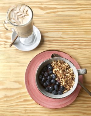 Iced caramel coffee with açaí bowl  at Orteá - Vegan Collective in Lisbon
