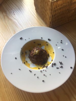Chocolate mousse speckled in passion fruit and mango at Orteá - Vegan Collective in Lisbon