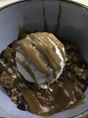 Red fruits and a crumble on the base, vanilla ice-cream with salted caramel on top at Orteá - Vegan Collective in Lisbon