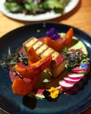 grilled tofu, pumpkin, pea mint purée, berry sauce  at Orteá - Vegan Collective in Lisbon