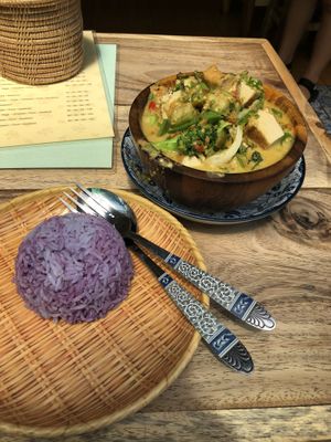 Purple rice and green curry  at The Family Restaurant in Bangkok