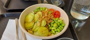 Noodles base, cucumber, cherry tomatoes, edamame, falafel and crispy oignons. Tasty! at Nouch in Annecy