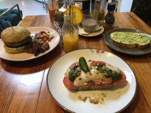 The Dutch Weed Burger and Caprese (with vegan mozzarella!)...both totally delicious. Avo on toast for our little one! at Nissa cafe in Hillegom