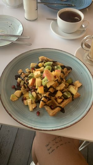 Waffle with fruits and chocolate sauce  at Cakester Cafe in Krakow
