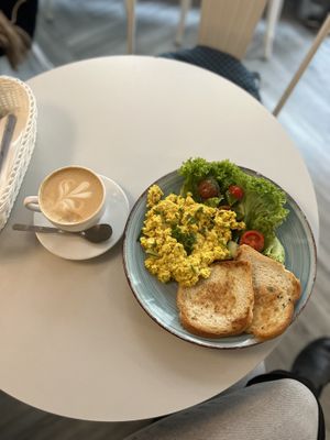 Cappuccino with soy milk and scrambled tofu   at Cakester Cafe in Krakow