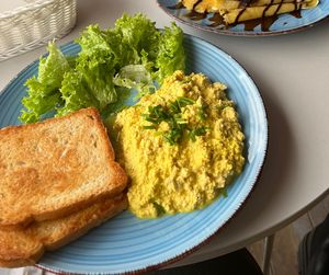 Scrambled tofu with toast  at Cakester Cafe in Krakow