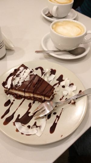 Vegan bounty cake and vegan cappuccino! at Cakester Cafe in Krakow