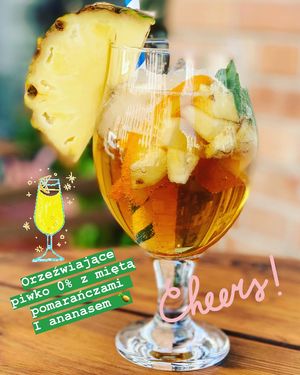 Piwko bezalkoholowe z pomarańczami miętą i ananasem 🍍  at Vegan Spot in Elblag