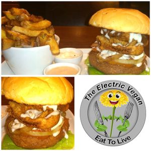 Mighty vegan burger with onion rings served on grilled spelt bun  at The Electric Vegan in Dublin