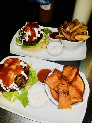 Vegan burgers served with either hand cut chips, butternut squash roasties or side salad  at The Electric Vegan in Dublin