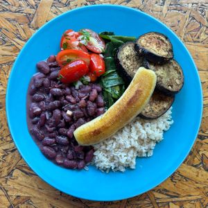 dish of the day: mineirinho with rice, red beans, grilled banana, grape tomato vinagrete, ora pro nóbis and baked eggplant. at Veg To Go in Sao Paulo