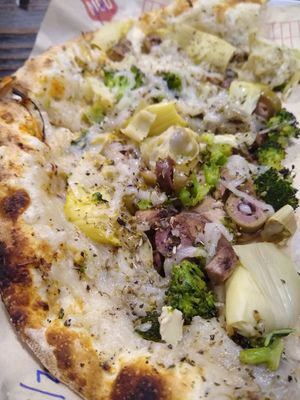 Basil, Artichokes, Mushrooms, Broccoli, Mixed Olives, Dairy-free Cheese, with Garlic Rub and Spices. at Mod Pizza in Kennesaw