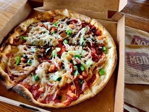 11" original crust with regular red sauce, VF cheese (Daiya) and sausage crumbles, diced tomato, onion, cucumbers, mushroom, green and red peppers at Mod Pizza in Annapolis