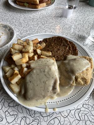 Biscuits gravy sausage and home fries at Spiral Diner & Bakery in Dallas
