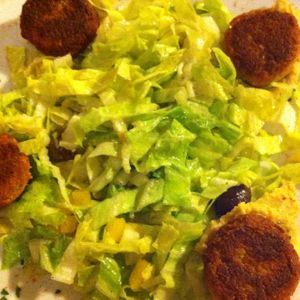 Falafel on chickpea cream and green salad at Veg Point in Tenna