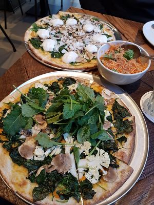 two vegan pizzas at Otomat in Bruges