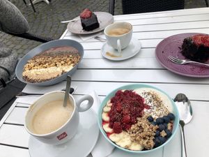 Breakfast! -Oatmeal, chocolate/peanut bowl, chocolate cake and coffee 😍 at Café Frida in Ulm