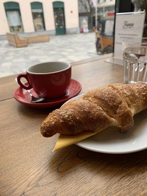 Vegan Apricot Croissant with coffeee  at Cafebrennerei Franze in Vienna