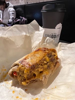 Vegan burrito and medium Fall Oat Boy at Gregory's Coffee - 8th Ave in New York City