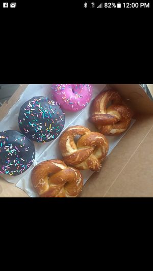 The OMG donut (Peanut butter brownie batter stuffed donut with chocolate glaze), Pink Ladies, and big, fluffy soft pretzels. Mix and match your dozens and half dozens!  at Brio Dessert Studio in Port Charlotte