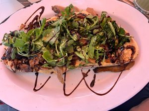Sourdough bread with hummus, mushrooms and arugula  at Liebling in Vienna
