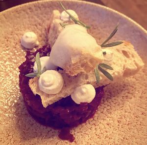 Beets tartar with hazelnut, carrot cream, lemon air and crunchy bread. at Stokey Veg Vegan in North London