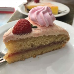 Vegan sponge with strawberry icing and vegan meringue -   at La Duchesse in North London