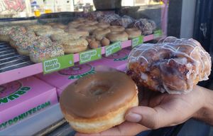 Maple donut $6.00, and blueberry fritter $7.50  at Grumpy Donuts in Camperdown