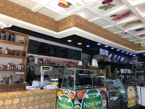 Colorful interior, upbeat Latino soundtrack  at Valerio in Flushing