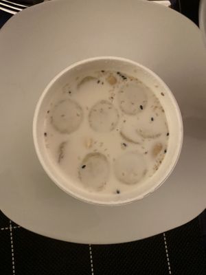 Coconut avocado soup with banana slices  at Nammi in Berlin