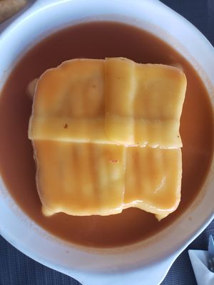 Cheesy goodness with vegetables and sausage inside at Spacos in Vila Praia De Ancora