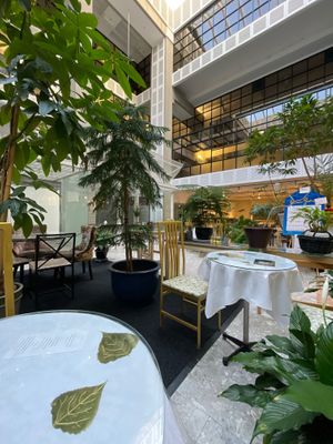 They’ve filled an area of the lobby outside of the glazed space with plants to make a series of peaceful seating areas at Peace-Garden in Ottawa