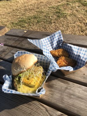 Cali green breakfast sandwich (£9.50) with sausage patty, melted cheese, tofu egg, sprouts and smashed avocado and hash browns (free).  at Vausages in Lichfield
