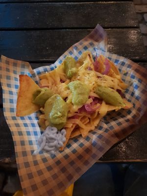 Nachos with vegan cheese, guac and red onions at Vausages in Lichfield