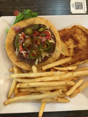 Yummy Yuma Impossible burger with vegan pepper Jack, spicy pickled jalapeños, and tostada shell (it works!). Fries are great.   at The Pint House in Yuma