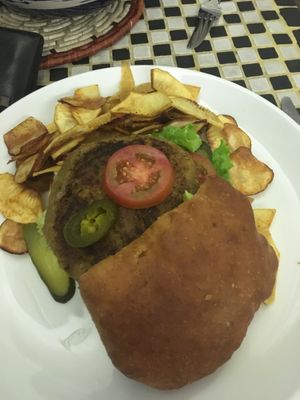 The vegetable burger....some people love it but was too salty for me. Loved the chips though. at NUGA Rosmead in Colombo