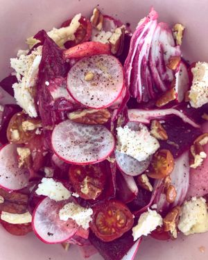 Salad of the day! Radicchio, radishes , pickles cherry tomatoes, goat rulo!  at Hambrë  in Ibiza