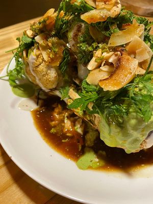 Roasted Cauliflower + vegetables stock + harissa chips at Hambrë  in Ibiza