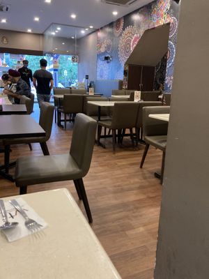 Comfortable seating on busy street  at Mr Naan & Mrs Idly in Kuala Lumpur