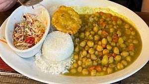 Salad, plantain, rice, and chickpea curry. at 11 Hauz in Park City