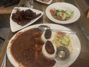 Plantains, cucumber salad, and SPECIAL stew beans  at 11 Hauz in Park City