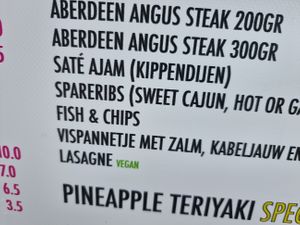 vegan options are clearly labeled on menu at Plein 4 in Eindhoven