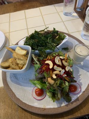 Basil stir fry, chips and salad at Ohkajhu Organic Restaurant in Bangkok