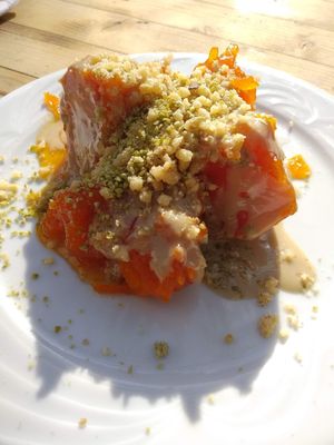 Pumpkin dessert topped with tahini and crushed walnuts and pistachios at Organic Cave Kitchen in Goreme