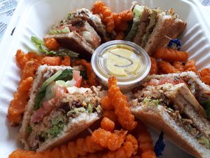 Vegan Club house with sweet potato fries to go. They have much more at M&Js Eatery in Bedford