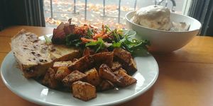 quiche and potatoes and buiscuts and gravy  at Sweetpea Baking Company in Portland