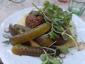 Mashed potatoes with vegan "meat" balls, sauce, herbs and sauce. at Muusa in Tampere
