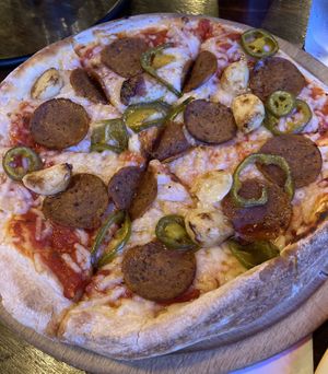 Vegan pepperoni pizza with jalapeños and garlic at G's Pizza - Howard Ave in New Orleans