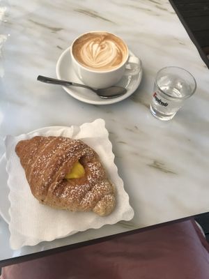 cappuccino and vegan croissant at Antico Caffe Scaletto in Bologna