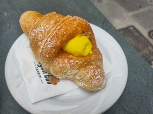 Croissant with custard ("crema") at Antico Caffe Scaletto in Bologna